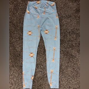 Light Blue Leggings with Metallic Gold Geometric Accents